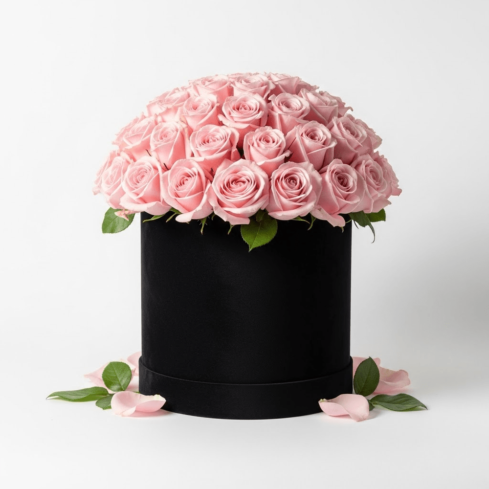 Boîte à chapeau avec roses roses